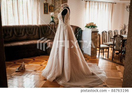 White wedding dress on the black dummy 88763196