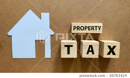 Top view of property tax text on wooden blocks. Tax concept. 88763424