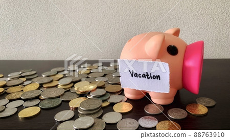 Saving money into piggy bank for vacation. Money concept. Saving money into piggy bank for vacation. Money concept. 88763910