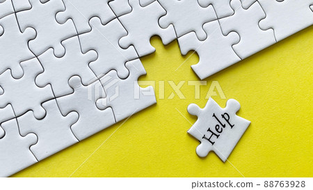 Help word on a jigsaw puzzle with yellow background. Help word on a jigsaw puzzle with yellow background. 88763928