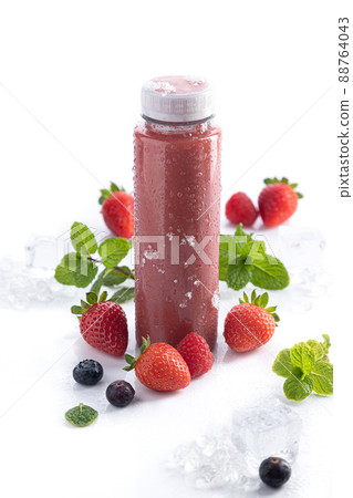 Strawberry smoothie bottle with detox superfood on white background and copy space. Vertical format. Healthy drinks concept. 88764043