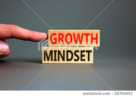 Growth mindset symbol. Wooden blocks with concept words Growth mindset on beautiful grey background. Businessman hand. Business growth mindset concept. Copy space. 88764091