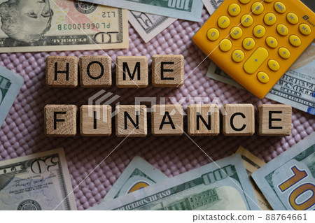 Home finance banknotes dollars and calculator closeup Home finance banknotes dollars and calculator closeup 88764661