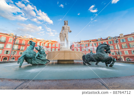Fountain of the Sun, Place Massena in center of Nice, France, Place Carlou Aubert, tourism, sunny day, blue sky, square tiles laid out in a checkerboard pattern, Apollon statue Fountain of the Sun, Place Massena in center of Nice, France, Place Carlou Aubert, tourism, sunny day, blue sky, square tiles laid out in a checkerboard pattern, Apollon statue 88764712