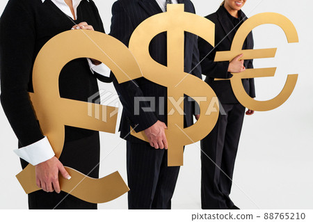 Anonymous Business People Holding Currency Pound Dollar Euro Symbols Anonymous Business People Holding Currency Pound Dollar Euro Symbols 88765210
