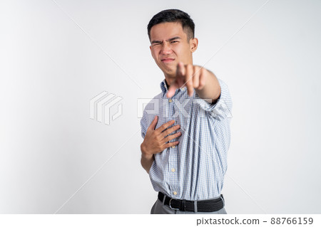 asian young businessman feeling disgusted by the smell asian young businessman feeling disgusted by the smell 88766159