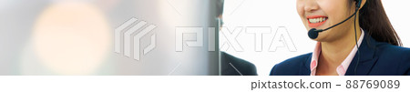 Business people wearing headset working in office in widen view 88769089