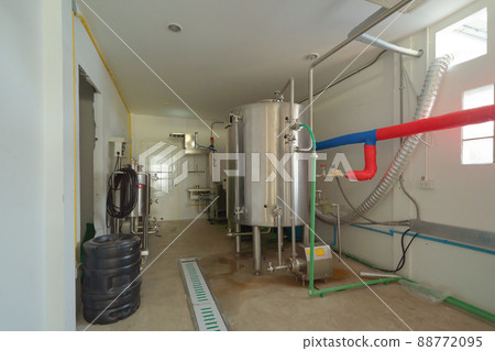 Brewery. Interior of a alcohol or beer drink machine room in kitchen bar of cafe or coffee shop. Business water pipe service. Fermenting. Brewery. Interior of a alcohol or beer drink machine room in kitchen bar of cafe or coffee shop. Business water pipe service. Fermenting. 88772095