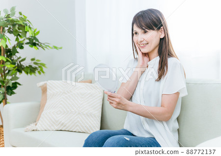 Middle-aged women doing skin care 88772137