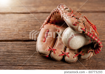 baseball on wooden desk baseball on wooden desk 88773293