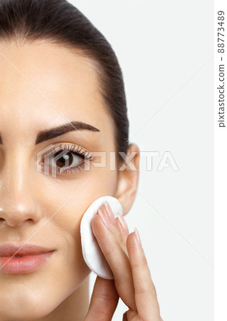 Beauty Face. Beautiful Woman With Natural Makeup.Skin Care. Woman Removing Face Makeup With Cotton Pad. Close Up Portrait Of Beautiful Healthy Girl With Nude Makeup Touching Perfect Soft Skin, 88773489