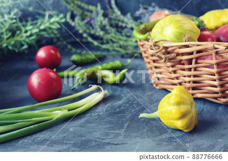 Vegetables and fruits in a wicker basket, healthy flowers and herbs, harvest season, organic natural food, healthy food, home cooking 88776666