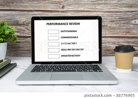 Performance review checklist text on white screen laptop or notebook. 88776905