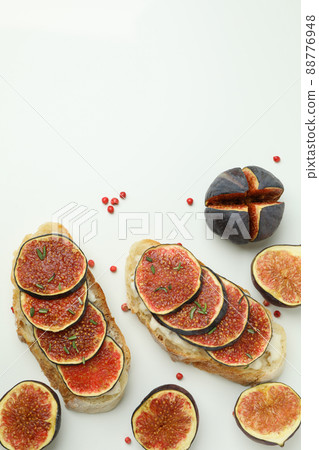 Tasty bruschetta with fig on white background 88776948