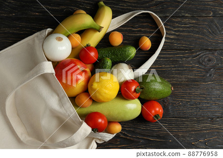 Cotton bag with vegetables and fruits on wooden table Cotton bag with vegetables and fruits on wooden table 88776958