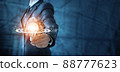 .Man holding lightbulb and brain with network of business 88777623