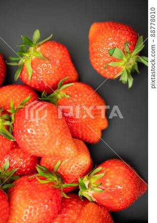 A large pile of delicious-looking strawberries A large pile of delicious-looking strawberries 88778010