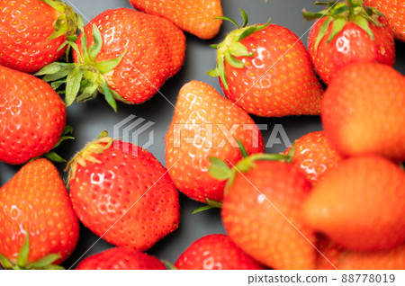 A large pile of delicious-looking strawberries A large pile of delicious-looking strawberries 88778019