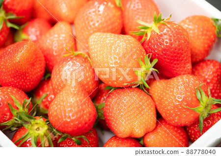 A large pile of delicious-looking strawberries A large pile of delicious-looking strawberries 88778040