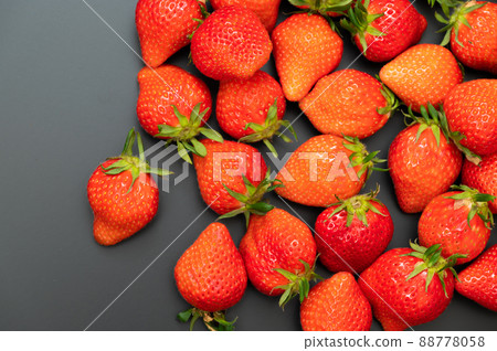 A large pile of delicious-looking strawberries A large pile of delicious-looking strawberries 88778058