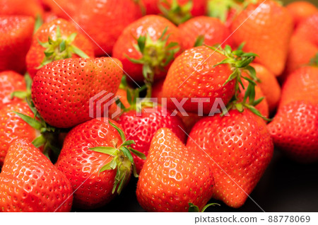 A large pile of delicious-looking strawberries A large pile of delicious-looking strawberries 88778069