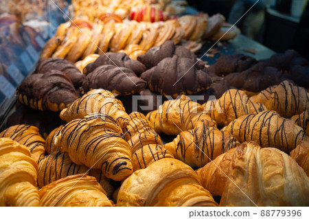 Croissants in the window. Different types of croissants. Chocolate croissants in a bakery Croissants in the window. Different types of croissants. Chocolate croissants in a bakery 88779396