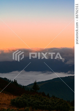 Petros Mountain in the morning fog, overcast mountain range at dawn, the magical mountains of Ukraine. 88782311