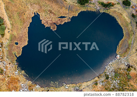 Lake Nesamovite mountain lake of the Ukrainian Carpathians, a lake in autumn. Lake Nesamovite mountain lake of the Ukrainian Carpathians, a lake in autumn. 88782318