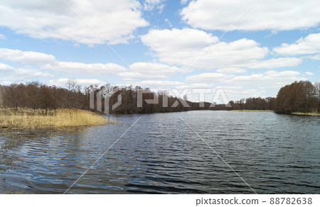 Spring landscape with riverside village 88782638