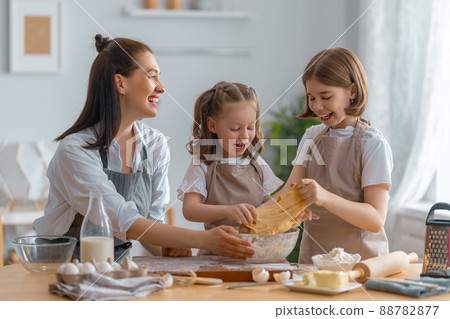 family are preparing bakery together family are preparing bakery together 88782877