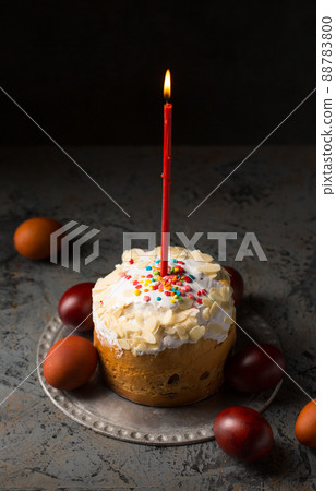 Easter cake with candle and eggs 88783800