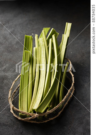 Stems of rhubarb in a basket Stems of rhubarb in a basket 88784035