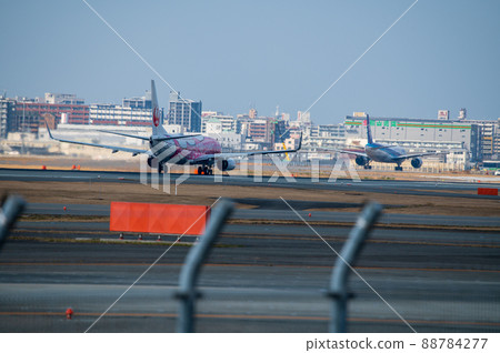 Passenger plane before takeoff while driving on the runway 88784277