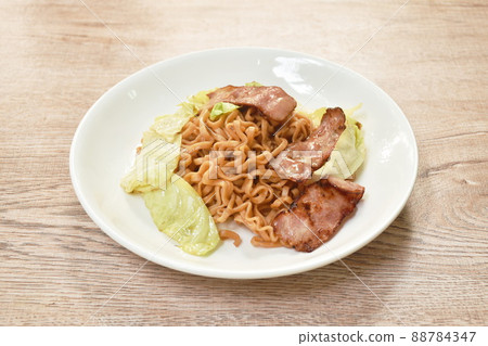 fried yakisoba Japanese noodles slice pork bacon and cabbage on plate fried yakisoba Japanese noodles slice pork bacon and cabbage on plate 88784347