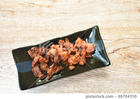 deep fried crispy salty chicken meat and gizzard on plate 88784350