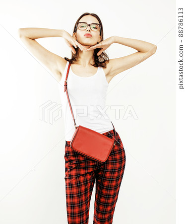 young pretty stylish hipster girl posing emotional isolated on white background happy smiling cool smile, lifestyle people concept close up 88786113