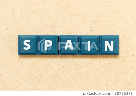 Tile alphabet letter in word spain on wood background Tile alphabet letter in word spain on wood background 88786371