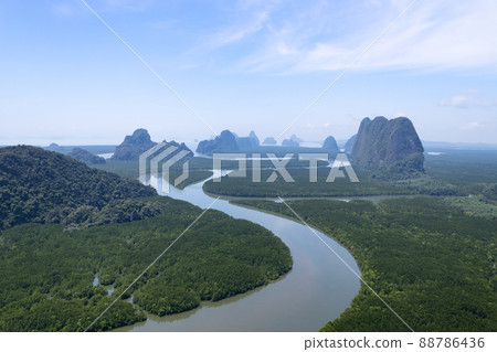 Aerial view drone shot of beautiful nature landscape forest in the morning Drone flying over sea and mangrove forest Landscape High angle view. Dynamic aerial shot Amazing nature panorama view Aerial view drone shot of beautiful nature landscape forest in the morning Drone flying over sea and mangrove forest Landscape High angle view. Dynamic aerial shot Amazing nature panorama view 88786436