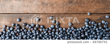 Fresh blueberries on wooden table. Panoramic banner. Top view 88786742