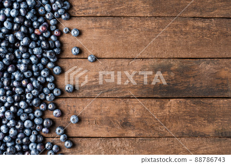 Fresh blueberries on wooden table. Top view 88786743