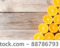 Orange halves on wooden background with copyspace 88786793