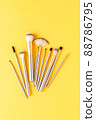 Gold makeup brushes. Top view 88786795