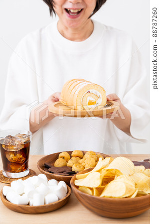 Middle woman snacking Middle woman snacking 88787260
