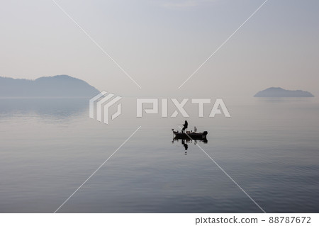 Chikubu Island and Sakura in Lake Biwa seen at Kaizu Osaki in Takashima City, Shiga Prefecture 88787672