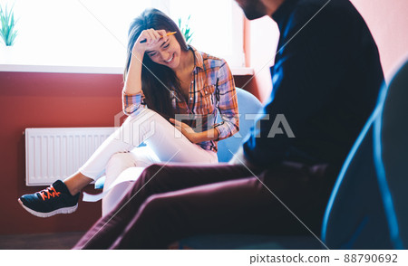 Happy woman laughing talking with man Happy woman laughing talking with man 88790692