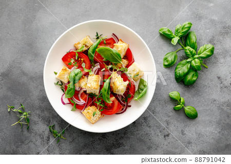 Tuscan Panzanella salad with tomatoes, basil and bread, top view Tuscan Panzanella salad with tomatoes, basil and bread, top view 88791042
