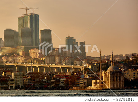 Ortakoy mosque under bosphorus bridge in istanbul, turkey. Bosphorus bridge between asia and europe. Ortakoy mosque under bosphorus bridge in istanbul, turkey. Bosphorus bridge between asia and europe. 88791815