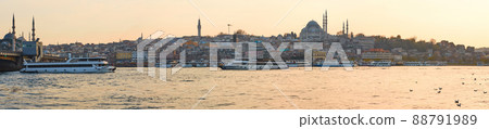 Tourist boat sails on the Golden Horn in Istanbul at sunset, Turkey. Tourist boat sails on the Golden Horn in Istanbul at sunset, Turkey. 88791989