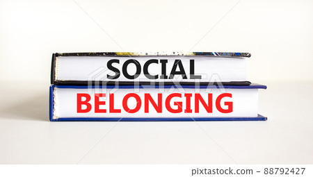 Social belonging symbol. Books with concept words Social belonging on beautiful white background. Business political social belonging concept. Copy space. 88792427