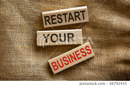 Wooden blocks form the text 'restart your business' on beautiful canvas background. Wooden blocks form the text 'restart your business' on beautiful canvas background. 88792435